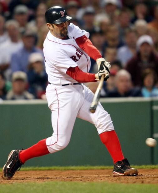 BOSTON - JULY 07:  Jason Varitek #33 of the Boston Red Sox hits a 2 RBI single in the third inning against the Oakland Athletics on July 7, 2009 at Fenway Park in Boston, Massachusetts.  (Photo by Elsa/Getty Images)