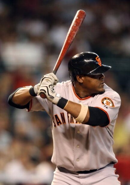PHOENIX - JUNE 11: Juan Uribe #5 of the San Francisco Giants at bat during the major league baseball game against the Arizona Diamondbacks at Chase Field on June 11, 2009 in Phoenix, Arizona. The Diamondbacks defeated the Giants 2-1. (Photo by Christia