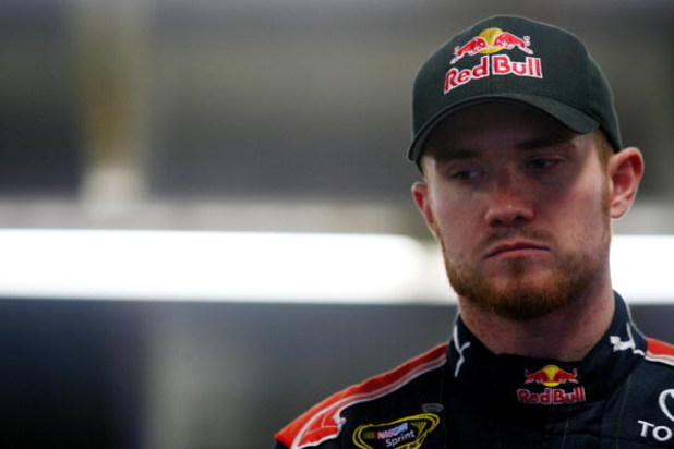CONCORD, NC - OCTOBER 15:  Brian Vickers, driver of the #83 Red Bull Toyota, stands in the garage during practice for the NASCAR Sprint Cup Series NASCAR Banking 500 at Lowe's Motor Speedway on October 15, 2009 in Concord, North Carolina.  (Photo by Jason