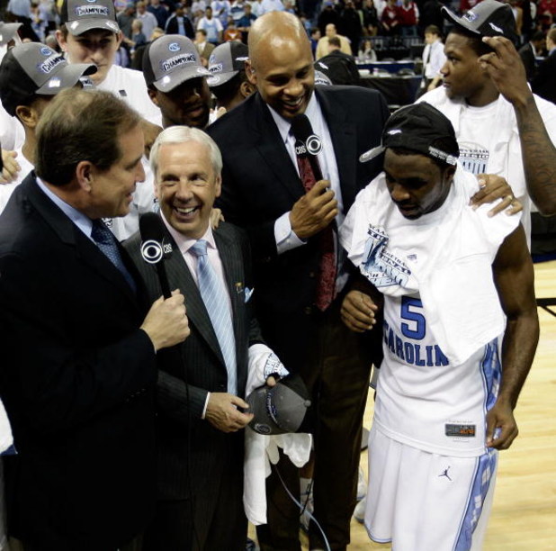 MEMPHIS, TN - MARCH 29:  CBS broadcasters Jim Nantz (L) and Clark Kellogg (2nd R) interview head coach Roy Williams (2nd L) and Ty Lawson #5 (R) of the North Carolina Tar Heels after the Tar Heels defeated the Oklahoma Sooners during the NCAA Men's Basket