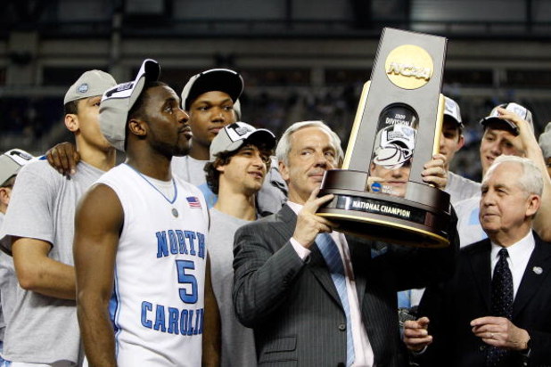 DETROIT - APRIL 06:  Head coach Roy Williams of the North Carolina Tar Heels celebrates with the championship trophy after defeating the Michigan State Spartans 89-72 during the 2009 NCAA Division I Men's Basketball National Championship game at Ford Fiel