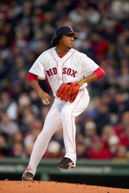 BOSTON - OCTOBER 18:  Pitcher Pedro Martinez #45 of the Boston Red Sox throws a pitch against the New York Yankees in the second inning during game five of the American League Championship Series on October 18, 2004 at Fenway Park in Boston, Massachusetts