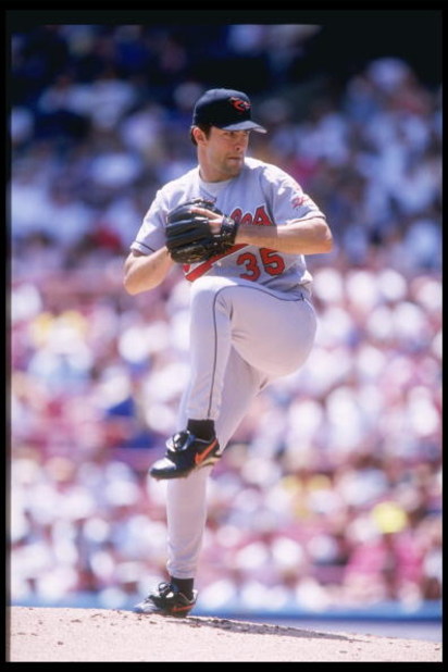 25 Jun 1997: Pitcher Mike Mussina of the Baltimore Orioles winds up to throw a pitch during the Orioles 9-1 win over the Milwaukee Brewers at Milwaukee County Stadium in Milwaukee, Wisconsin.
