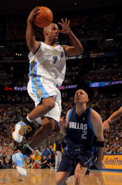 DENVER - MAY 13:  Chauncey Billups #7 of the Denver Nuggets dishes off a pass as Jason Kidd #2 of the Dallas Mavericks defends in Game Five of the Western Conference Semifinals during the 2009 NBA Playoffs at Pepsi Center on May 13, 2009 in Denver, Colora