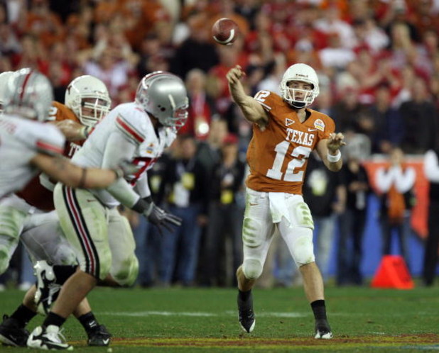 GLENDALE, AZ - JANUARY 05:  Quarterback Colt McCoy #12 of the Texas Longhorns throws a pass against the Ohio State Buckeyes during the Tostitos Fiesta Bowl Game on January 5, 2009 at University of Phoenix Stadium in Glendale, Arizona.   The Longhorns defe