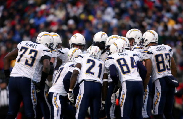 FOXBORO, MA - JANUARY 20:  (L-R) Marcus McNeill #73, Philip Rivers #17, LaDainian Tomlinson #21, Craig Davis #84 and Vincent Jackson #83 of the San Diego Chargers huddle up against the New England Patriots during the AFC Championship Game on January 20, 2