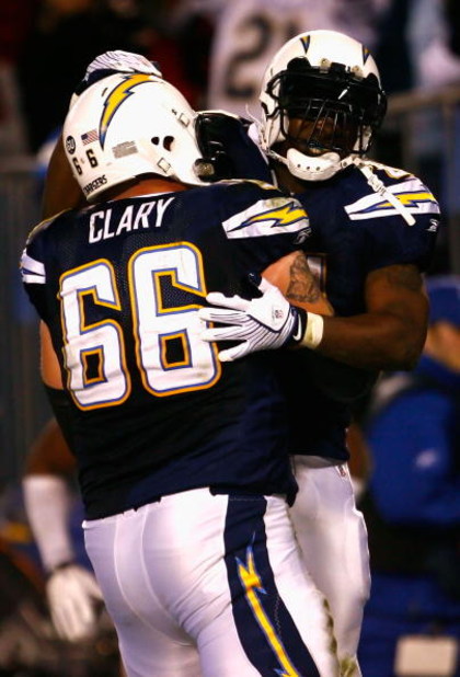 SAN DIEGO - DECEMBER 28:  Runningback LaDainian Tomlinson #21 of the San Diego Chargers celebrates with teammate Jeromey Clary #66 after Tomlinson scored a 14 yard rushing touchdown against the Denver Broncos during the third quarter of the NFL game at Qu
