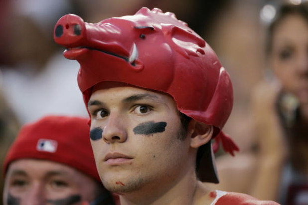 FAYETTEVILLE, AR - SEPTEMBER 2:  A male fan of the Arkansas Razorbacks looks on wearing eye black and a hog hat during the game against the University of Southern California Trojans on September 2, 2006 at Donald W. Reynolds Razorback Stadium in Fayettevi