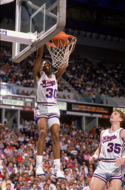 SACRAMENTO, CA - 1988:  Kenny Smith #30 of the Sacramento Kings dunks the ball during an NBA game at Arco Arena in Sacramento, California in 1988.  (Photo by: Mike Powell/Getty Images)