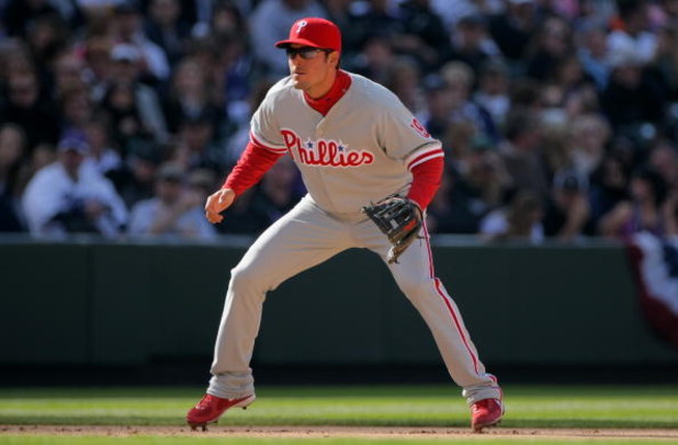 DENVER - APRIL 10:  Third baseman Greg Dobbs #19 of the Philadelphia Phillies plays defense against the Colorado Rockies during MLB action on Opening Day at Coors Field on April 10, 2009 in Denver, Colorado. The Rockies defeated the Phillies 10-3.  (Photo