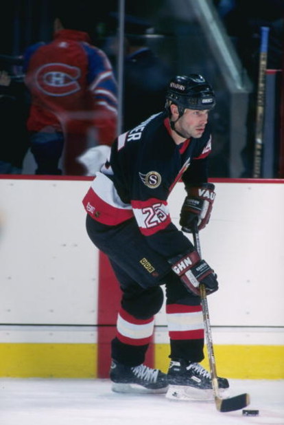 15 Mar 1997: Center Bruce Gardiner of the Ottawa Senators moves down the ice during a game against the Montreal Canadiens at The Forum in Montreal, Quebec. The game was a tie, 2-2.