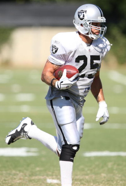 NAPA, CA - AUGUST 05:  Justin Fargas #25 runs with the ball during the Oakland Raiders Training Camp at the Napa Valley Marriott on August 5, 2009 in Napa, California.  (Photo by Jed Jacobsohn/Getty Images)