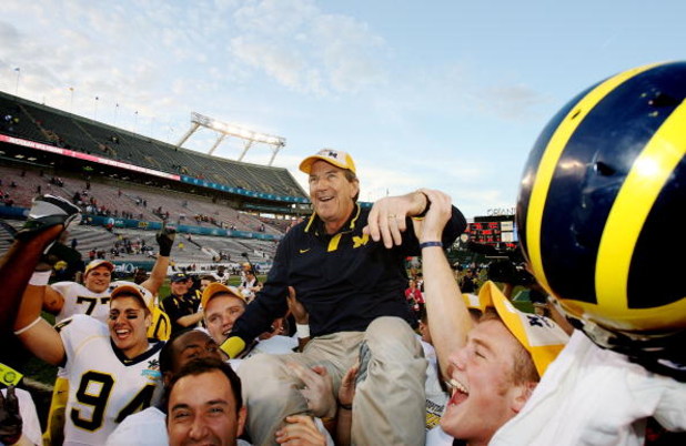 ORLANDO, FL - JANUARY 01:  Head coach Lloyd Carr of the Michigan Wolverines is carried off the field after ending his coaching career with a victory over the Florida Gators in the Capital One Bowl at Florida Citrus Bowl on January 1, 2008 in Orlando, Flor