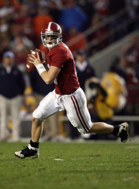 TUSCALOOSA, AL - NOVEMBER 29:  Quarterback Greg McElroy #12 of the Alabama Crimson Tide rolls out to pass against the Auburn Tigers at Bryant-Denny Stadium on November 29, 2008 in Tuscaloosa, Alabama. Alabama defeated Auburn 36-0.  (Photo by Doug Benc/Get