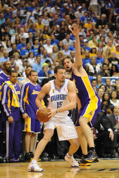 ORLANDO, FL - JUNE 14:  Hedo Turkoglu #15 of the Orlando Magic looks to move the ball against Pau Gasol #16 of the Los Angeles Lakers in Game Five of the 2009 NBA Finals on June 14, 2009 at Amway Arena in Orlando, Florida. The Lakers won 99-86.  NOTE TO U