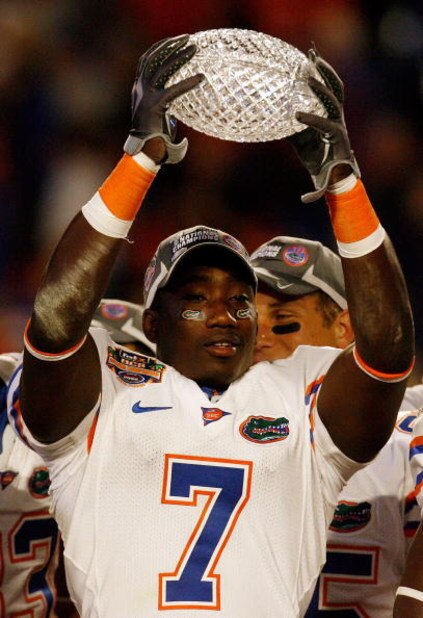 MIAMI - JANUARY 08: Justin Williams #7 of the Florida Gators celebrate with the trophy after defeating the Oklahoma Sooners in the FedEx BCS National Championship Game at Dolphin Stadium on January 8, 2009 in Miami, Florida. The Gators won the game by a