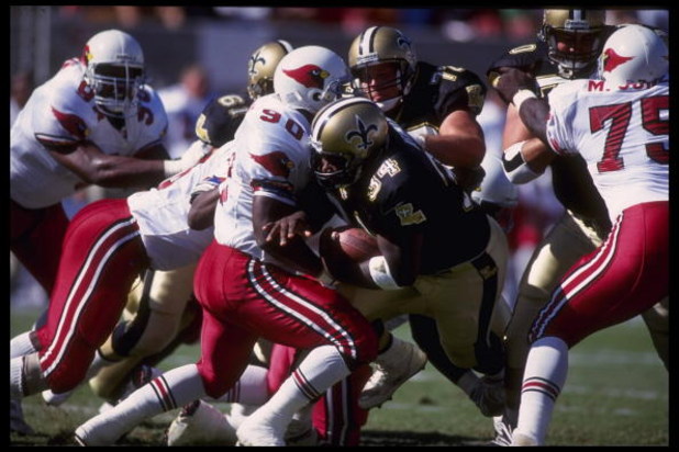 18 Oct 1992: Running back Craig Heyward #34 of the New Orleans Saints crashes through the defensive line of the Arizona at Busch Stadium in Tempe, Arizona. The Saints defeated the Cardinals 30-21. Mandatory Credit: Stephen Dunn/Allsport