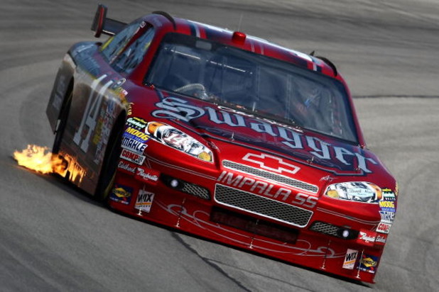 LONG POND, PA - AUGUST 01: Tony Stewart drives the #14 Old Spice Swagger Chevrolet during practice for the NASCAR Sprint Cup Series Sunoco Red Cross Pennsylvania 500 at the Pocono Raceway on August 1, 2009 in Long Pond, Pennsylvania.  (Photo by Chris McGr