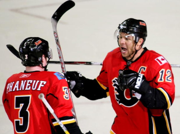 CALGARY, AB - APRIL 22: Jarome Iginla #12 and Dion Phaneuf #3 of the Calgary Flames celebrate Iginla's empty net goal to seal the win against the Chicago Blackhawks in Game Four of the Western Conference Quarterfinals of the 2009 Stanley Cup Playoffs on A