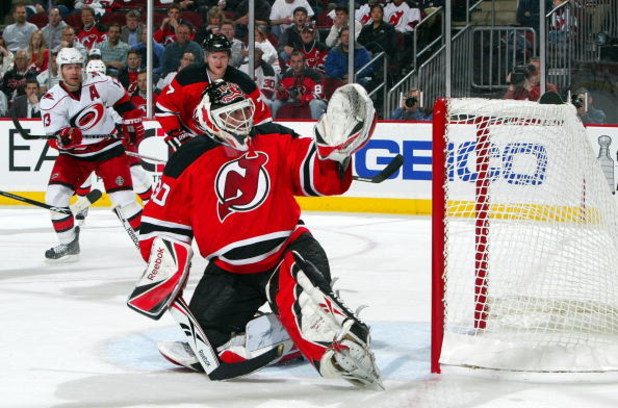 NEWARK, NJ - APRIL 23:  Martin Brodeur #30 of the New Jersey Devils defends his net against the Carolina Hurricanes during Game Five of the Eastern Conference Quarterfinal Round of the 2009 NHL Stanley Cup Playoffs on April 23, 2009 at the Prudential Cent