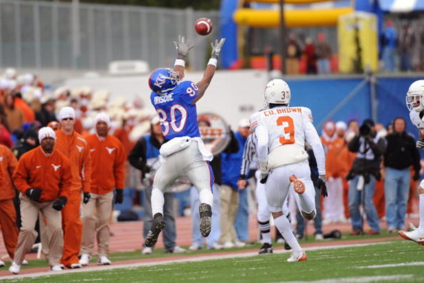 LAWRENCE, KS - NOVEMBER 15:  Dezmon Briscoe #80 of the Kansas Jayhawks attempts to make a reception against the Texas Longhorns on November 15, 2008 at Memorial Stadium in Lawrence, Kansas.  Texas defeated Kansas 35-7. (Photo by G. Newman Lowrance/Getty I
