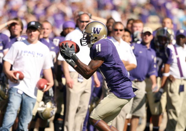 SEATTLE - SEPTEMBER 6:  D'Andre Goodwin #11 of the Washington Huskies holds on to the ball during their game against the BYU Cougars on September 6, 2008 at Husky Stadium in Seattle, Washington. The Cougars defeated the Huskies 28-27. (Photo by Otto Greul