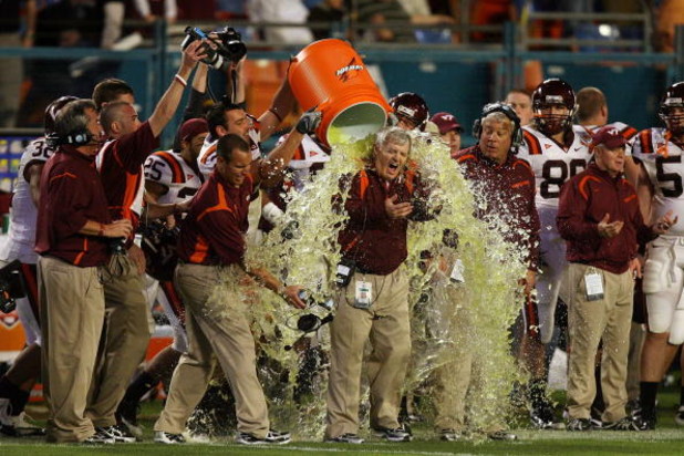 MIAMI - JANUARY 01:  Head coach Frank Beamer of the Virginia Tech Hokies gets gatorade dump on him by his players on their way to winning against the Cincinnati Bearcats during the FedEx Orange Bowl at Dolphin Stadium on January 1, 2009 in Miami, Florida.