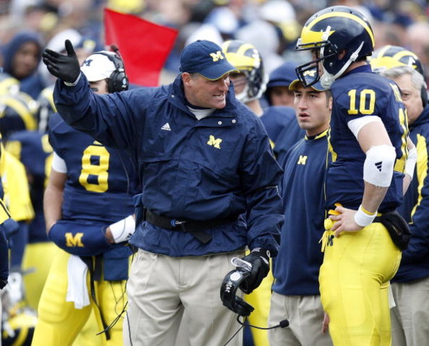 ANN ARBOR, MI - OCTOBER 25: Head coach Rich Rodriguez of the Michigan Wolverines talks with Steven Threet #10 while playing the Michigan State Spartans on October 25, 2008 at Michigan Stadium in Ann Arbor, Michigan.  (Photo by Gregory Shamus/Getty Images)