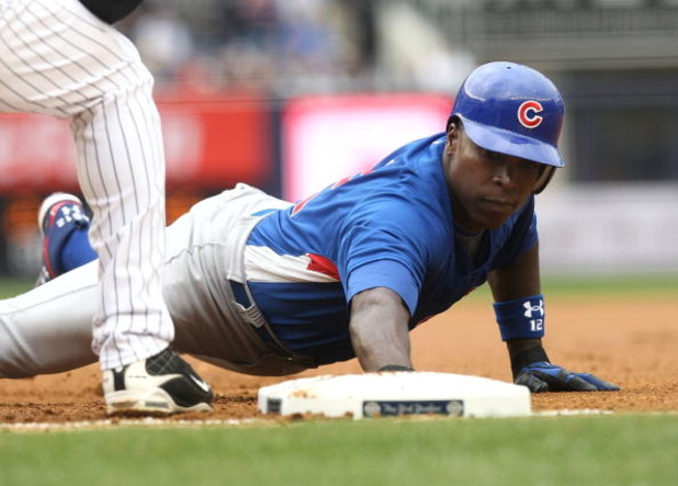 NEW YORK - APRIL 04:  Alfonso Soriano #12 of the Chicago Cubs dives back into first base against the New York Yankees during their game on April 4, 2009 at Yankee Stadium in the Bronx borough of New York City.  (Photo by Nick Laham/Getty Images)
