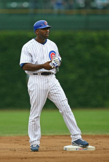 CHICAGO - AUGUST 28: Milton Bradley #21 of the Chicago Cubs stands on second base after hitting a double against the New York Mets on August 28, 2009 at Wrigley Field in Chicago, Illinois. The Cubs defeated the Mets 5-2. (Photo by Jonathan Daniel/Getty Im
