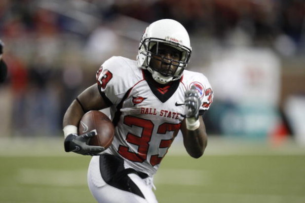 DETROIT - DECEMBER 5:  MiQuale Lewis #33 of the Ball State Cardinals runs the ball against the Buffalo Bulls during the MAC Championship game on December 5, 2008 at Ford Field in Detroit Michigan. (Photo by: Gregory Shamus/Getty Images)