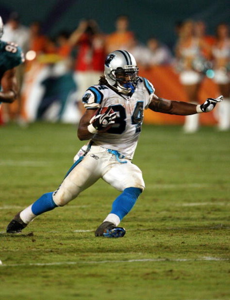 MIAMI - AUGUST 22:  Running back DeAngelo Williams #34 of the Carolina Panthers looks for room to run against the Miami Dolphins during a pre-season game at Land Shark Stadium on August 22, 2009 in Miami, Florida. The Dolphins defeated the Panthers 27-17.