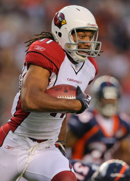 DENVER - SEPTEMBER 3: Wide receiver Larry Fitzgerald #11 of the Arizona Cardinals runs on a thirty six yard reception during the NFL preseason game against the Denver Broncos at Invesco Field at Mile High on September 3, 2009 in Denver, Colorado.  (Photo 