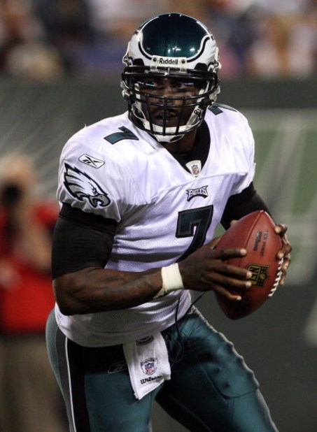 EAST RUTHERFORD, NJ - SEPTEMBER 03:  Michael Vick #7 of the Philadelphia Eagles looks to throw a pass against the New York Jets on September 3, 2009 at Giants Stadium in East Rutherford, New Jersey. The Jets defeated the Eagles 38-27.  (Photo by Jim McIsa