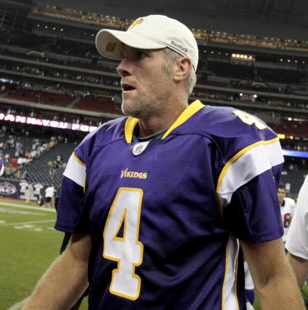 HOUSTON - AUGUST 31: Quarterback Brett Favre #4 of the Minnesota Vikings leaves the field after leading the Vikings to a 17-10 win over the Houston Texans at Reliant Stadium on August 31, 2009 in Houston, Texas. (Photo by Bob Levey/Getty Images)