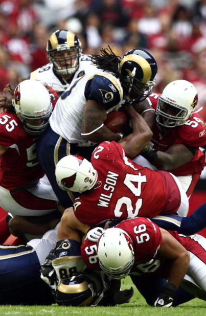 GLENDALE, AZ - DECEMBER 7:  Runningback Steven Jackson #39 of the St. Louis Rams is tackled by the defense of the Arizona Cardinals during their NFL Game on December 7, 2008 at the University of Phoenix Stadium in Glendale, Arizona. (Photo by Donald Miral