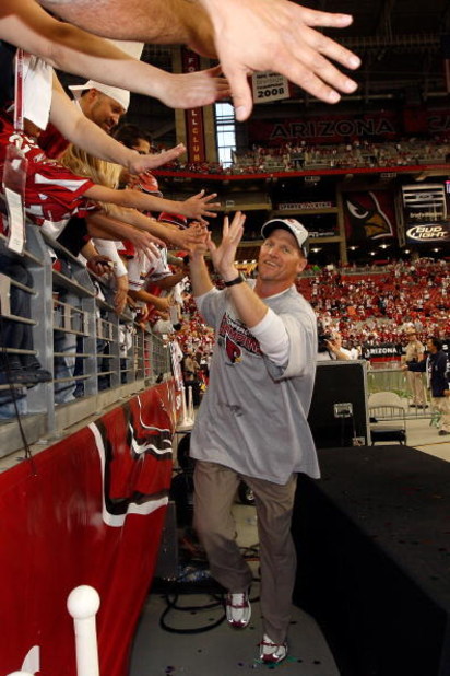 GLENDALE, AZ - JANUARY 18:  Head coach Ken Whisenhunt of the Arizona Cardinals celebrates with fans following the NFC championship game against the Philadelphia Eagles on January 18, 2009 at University of Phoenix Stadium in Glendale, Arizona. The Cardinal