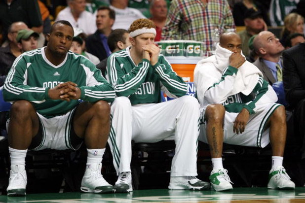 BOSTON - MAY 17:  Glen Davis #11, Brian Scalabrine #44 and Stephon Marbury #8 of the Boston Celtics watch from the bench as  the Orlando Magic win Game Seven of the Eastern Conference Semifinals during the 2009 NBA Playoffs at TD Banknorth Garden on May 1