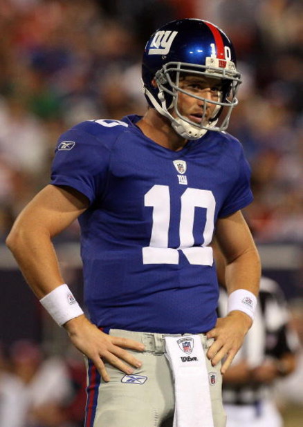 EAST RUTHERFORD, NJ - AUGUST 29:  Eli Manning #10 of the New York Giants looks on against the New York Jets on August 29, 2009 at Giants Stadium in East Rutherford, New Jersey.  (Photo by Jim McIsaac/Getty Images)