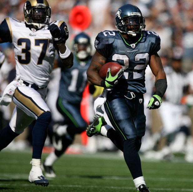SEATTLE - SEPTEMBER 13:  Running back Julius Jones #22 of the Seattle Seahawks rushes for a touchdown in the third quarter against James Butler #37 of the St. Louis Rams on September 13, 2009 at Qwest Field in Seattle, Washington. The Seahawks defeated th