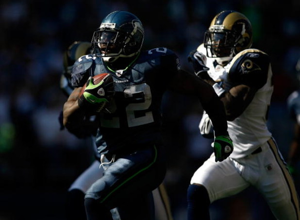 SEATTLE , WA - SEPTEMBER 13:  Julius Jones #22 runs for a touchdown against the Seattle Seahawks of the St. Louis Rams at Qwest Field on September 13, 2009 in Seattle, Washington.  (Photo by Jonathan Ferrey/Getty Images)