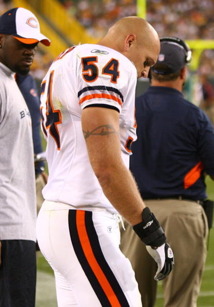 GREEN BAY, WI - SEPTEMBER 13: Brian Urlacher #54 of the Chicago Bears stands on the sidelines after being injured near the end of the first half against the Green Bay Packers on September 13, 2009 at Lambeau Field in Green Bay, Wisconsin. The Packers defe