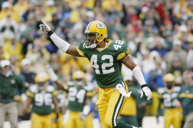 GREEN BAY, WI - NOVEMBER 10:  Free Safety Darren Sharper #42 of the Green Bay Packers celebrates during the NFL game against the Detroit Lions at Lambeau Field on November 10, 2002 in Green Bay, Wisconsin. The Packers defeated the Lions 40-14.  (Photo by 