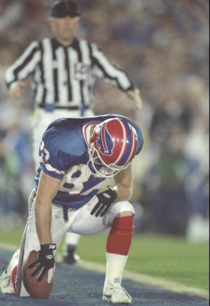31 Jan 1993:  Wide receiver Don Beebe of the Buffalo Bills prays after scoring a touchdown during the Super Bowl XXVII game against the Dallas Cowboys at the Rose Bowl in Pasadena, California.  The Cowboys won over the Bills 52-17. Mandatory Credit: Mike